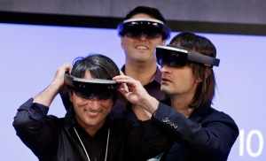 Corporate Vice President Joe Belfiore tries HoloLens during the Microsoft event.